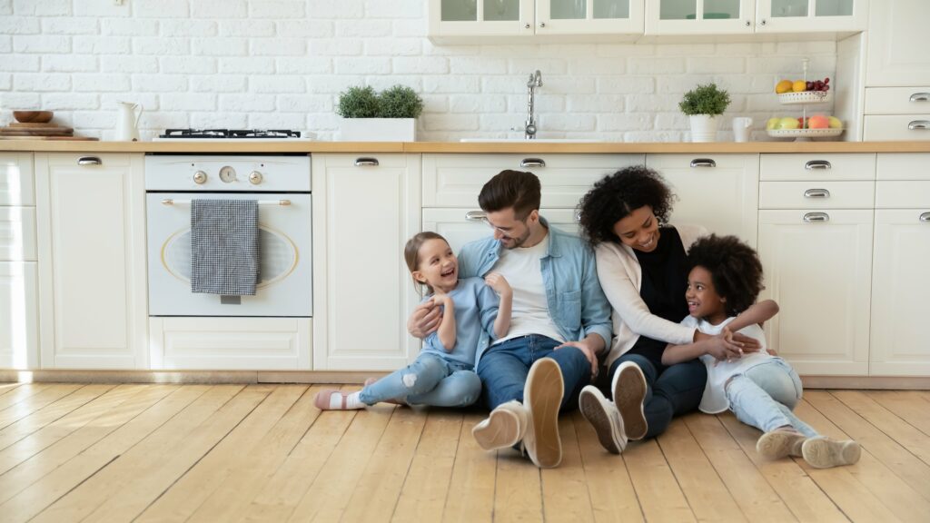 family sitting on floor