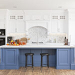Kitchen with blue and white cabinets and wood floors