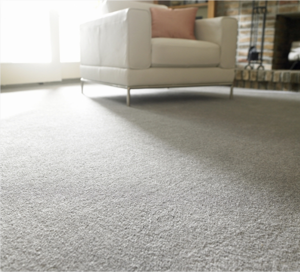 White chair in room with light carpet