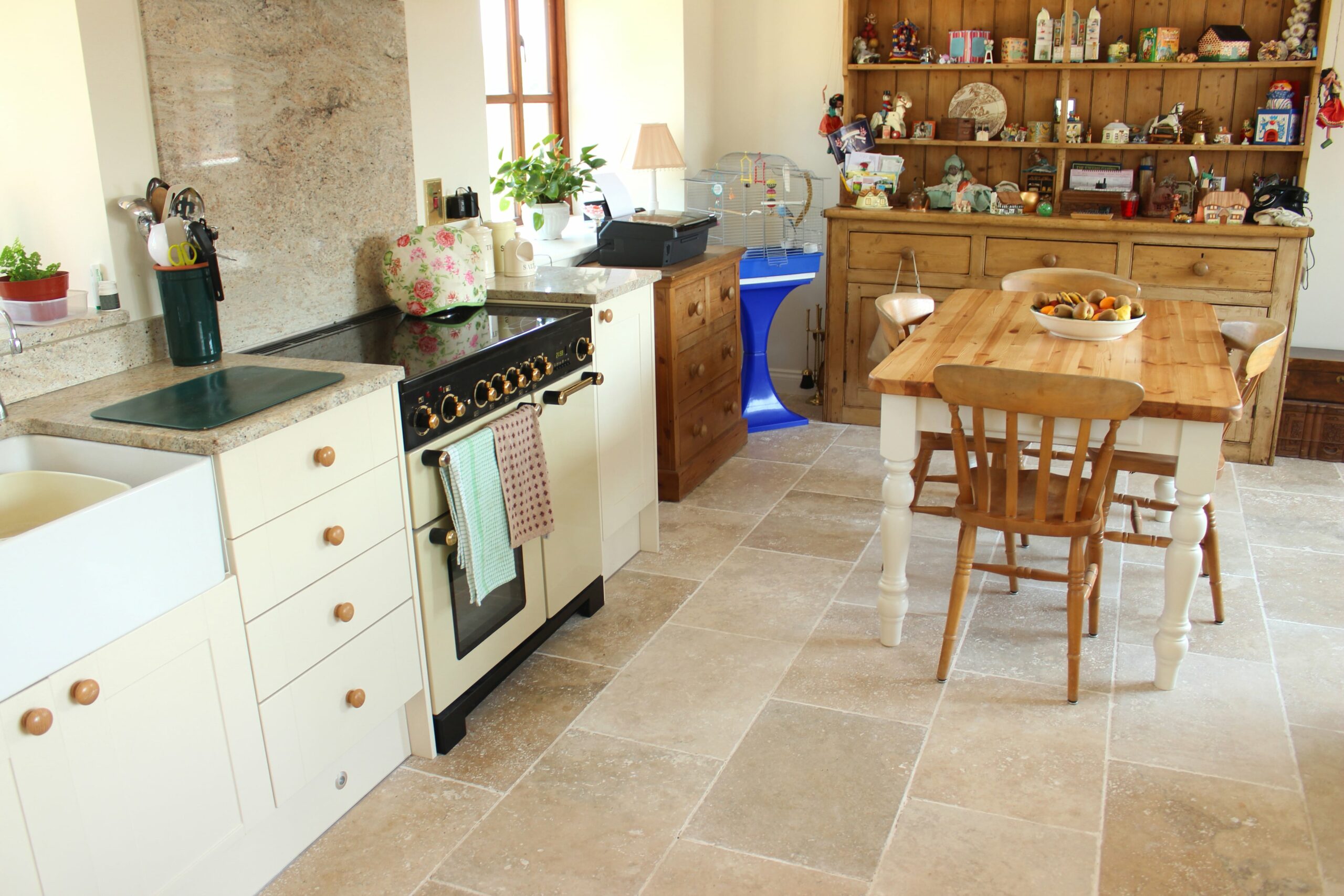 kitchen with tile floors and white cabinets