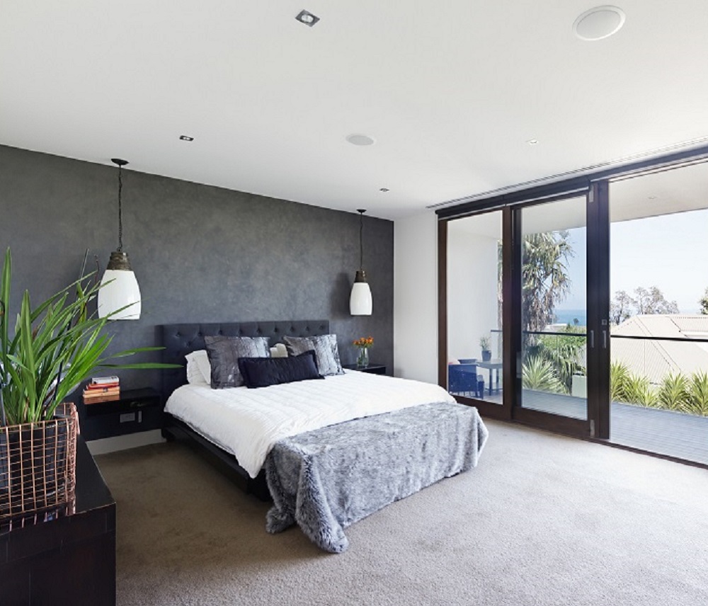 grey wall in bedroom with carpet