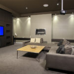 home theater man cave with carpet in basement