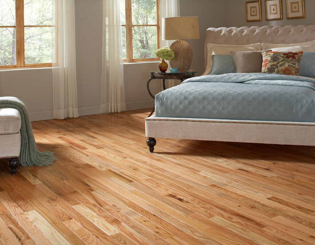 Oak Place: Natural 2-1/4" Solid Hardwood Flooring in Bedroom