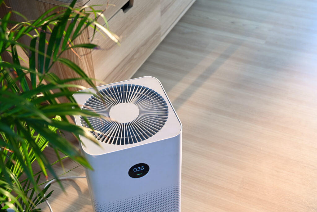 Air purifier on wooden floor in comfortable home. Fresh air and