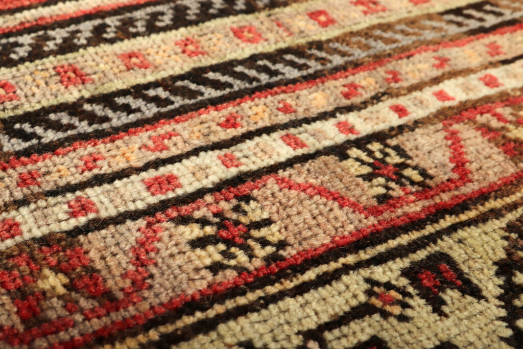 Textures and patterns in color from woven carpets