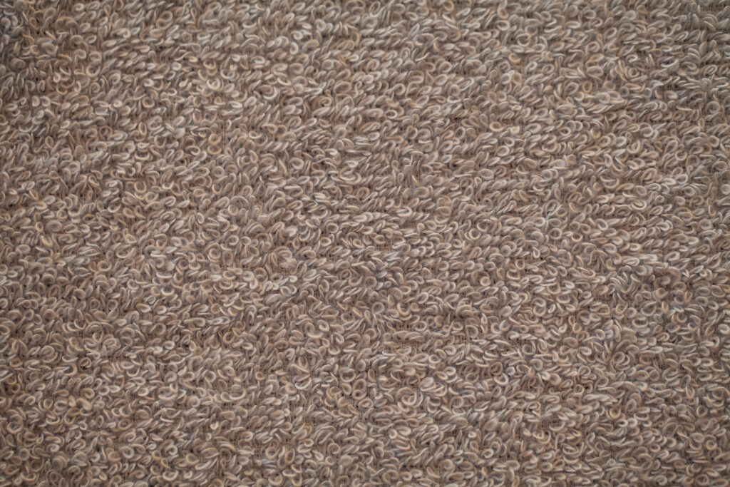 Gray terry natural cotton towel background texture.