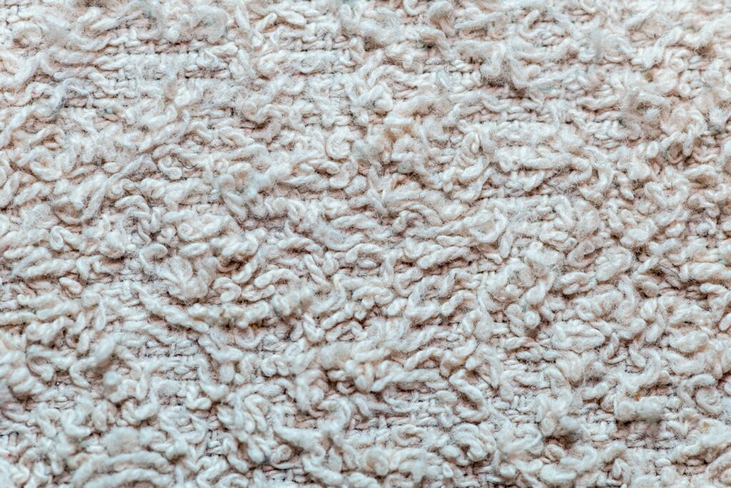 A warm and light colored woolen fabric texture background