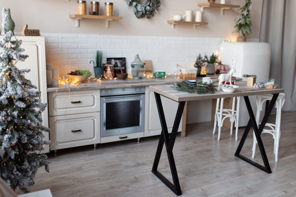 Christmas decor in kitchen. Christmas tableware. Christmas cooking utensils. Bright interior of New Year`s cuisine. New Year card. Decoration, home.