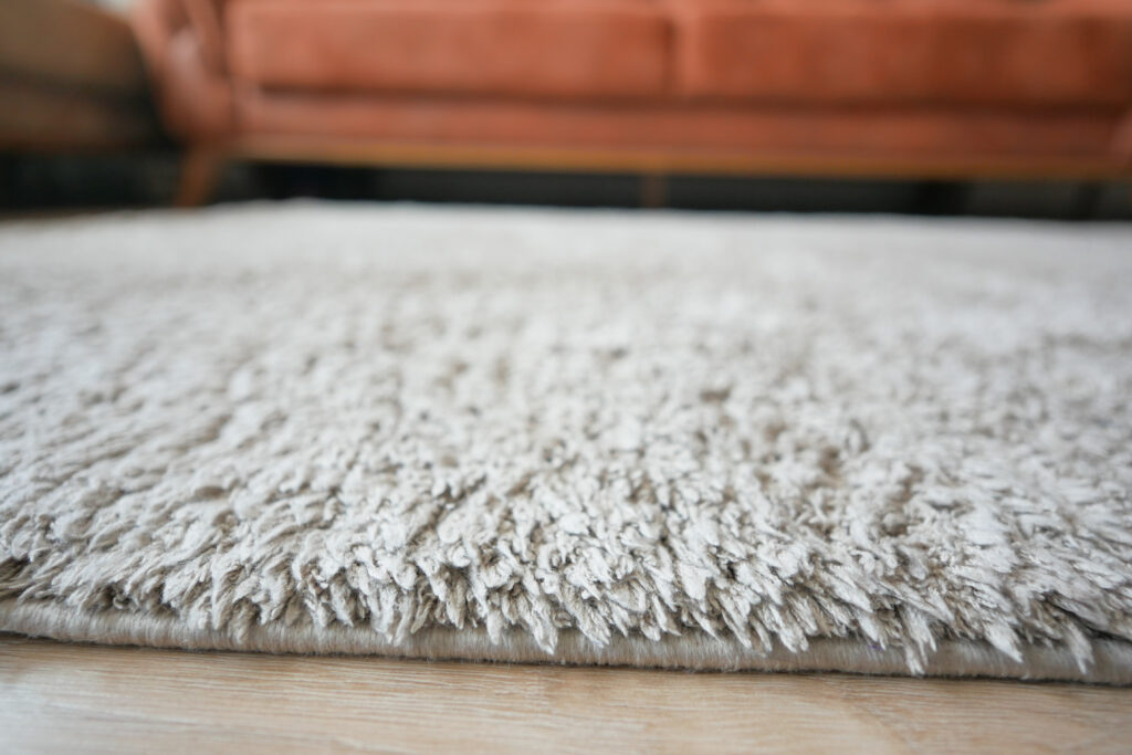 carpet texture background on wooden floor with copy space .